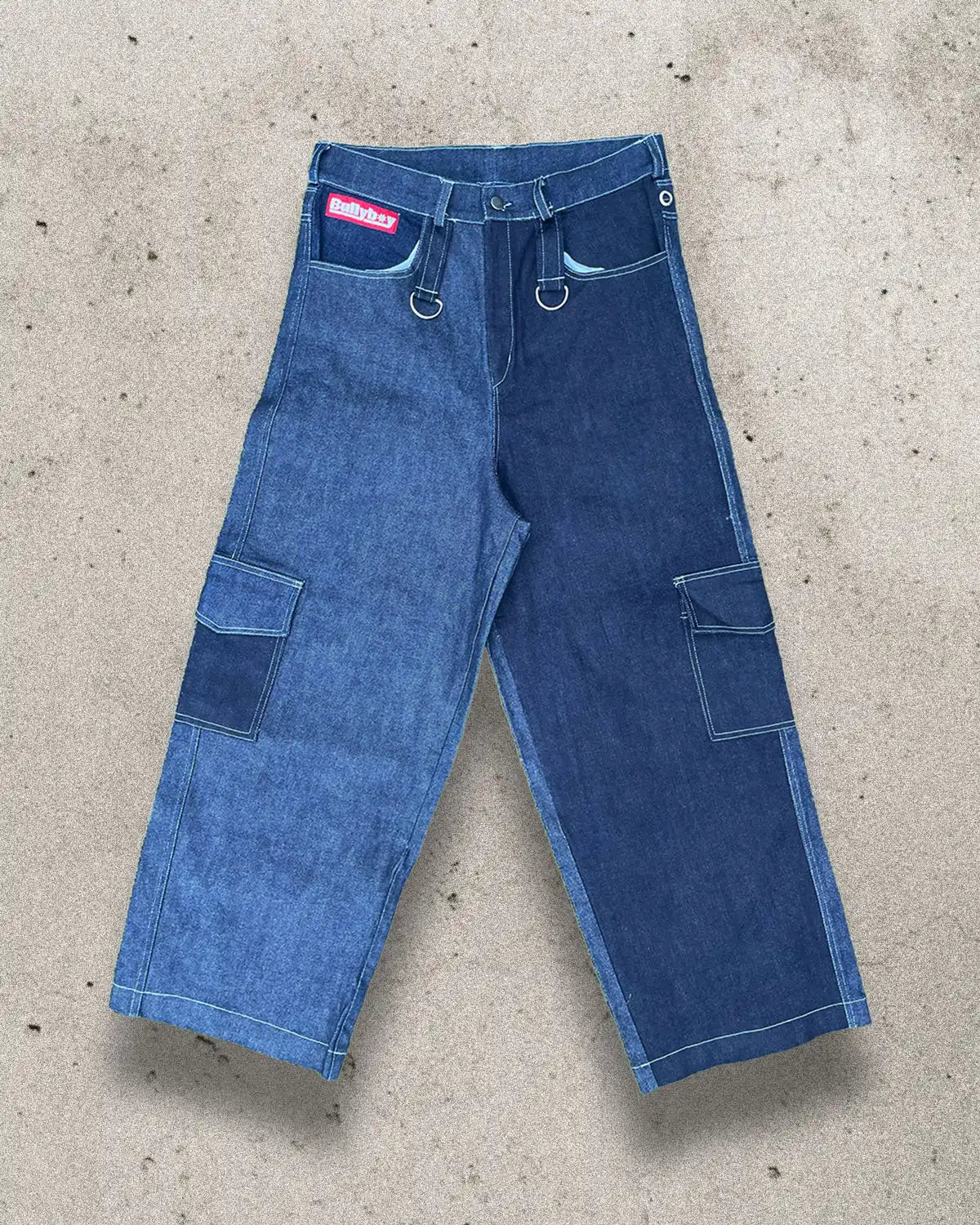 A pair of blue denim cargo pants featuring multiple pockets, designed as baggy unisex trousers for premium streetwear