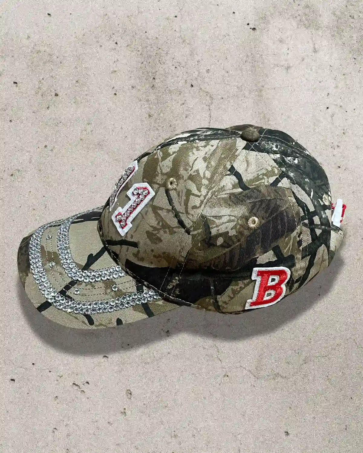 Streetwear cap with rhinestone detailing and embroidered angel numbers.