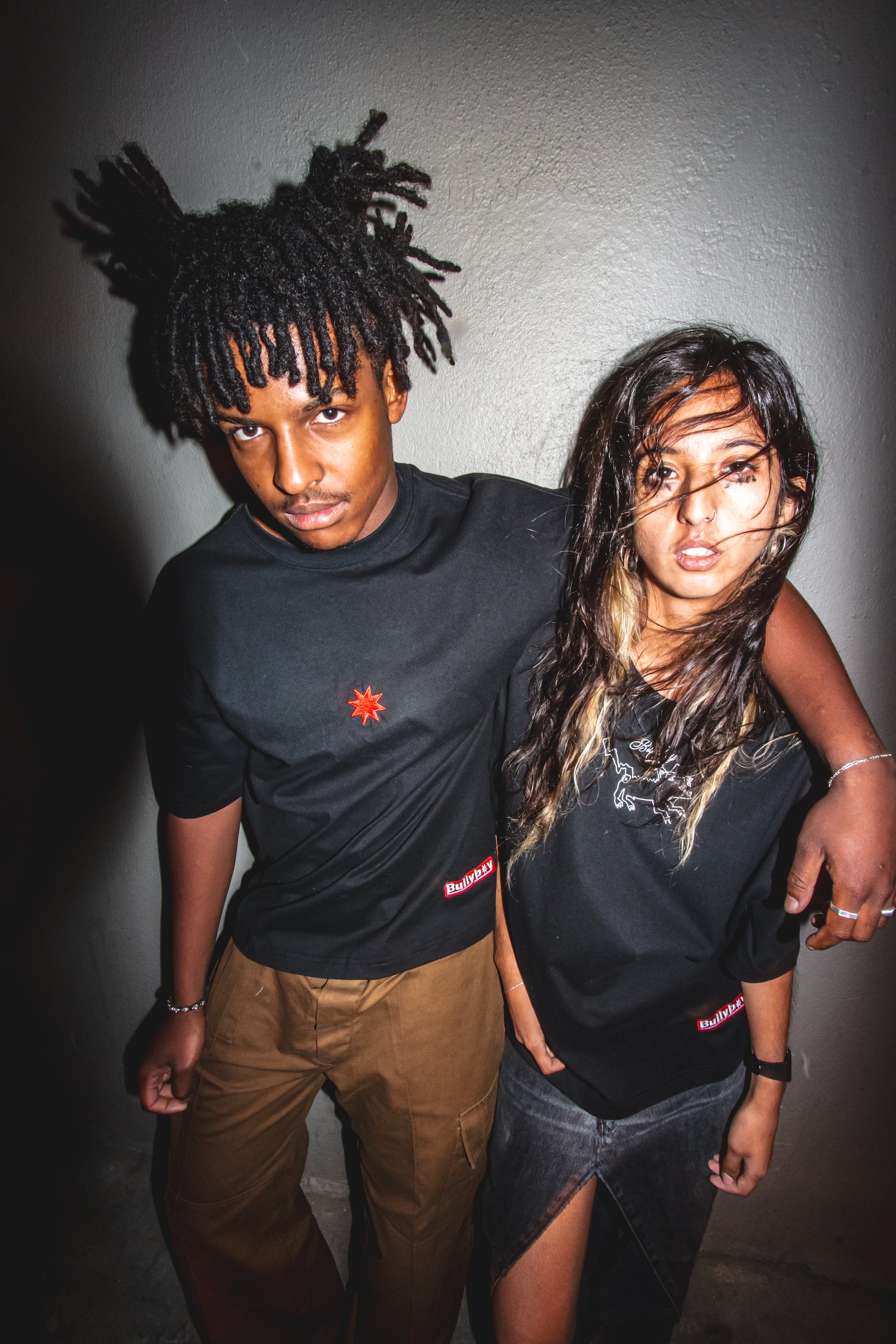 A shot from the Bullyboy Drop02 campaign shoot with Bullyboy models wearing the WOOF tee and the black daily tee
