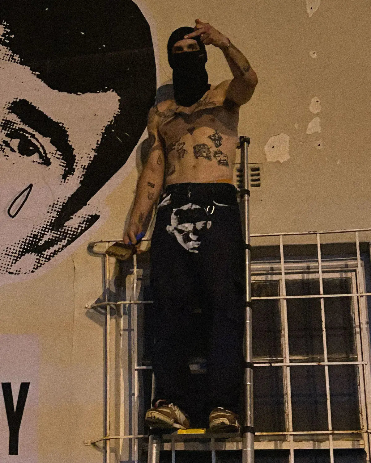 Baggy unisex skater pants made from ethically sourced offcuts featuring a bold white print on the crotch.