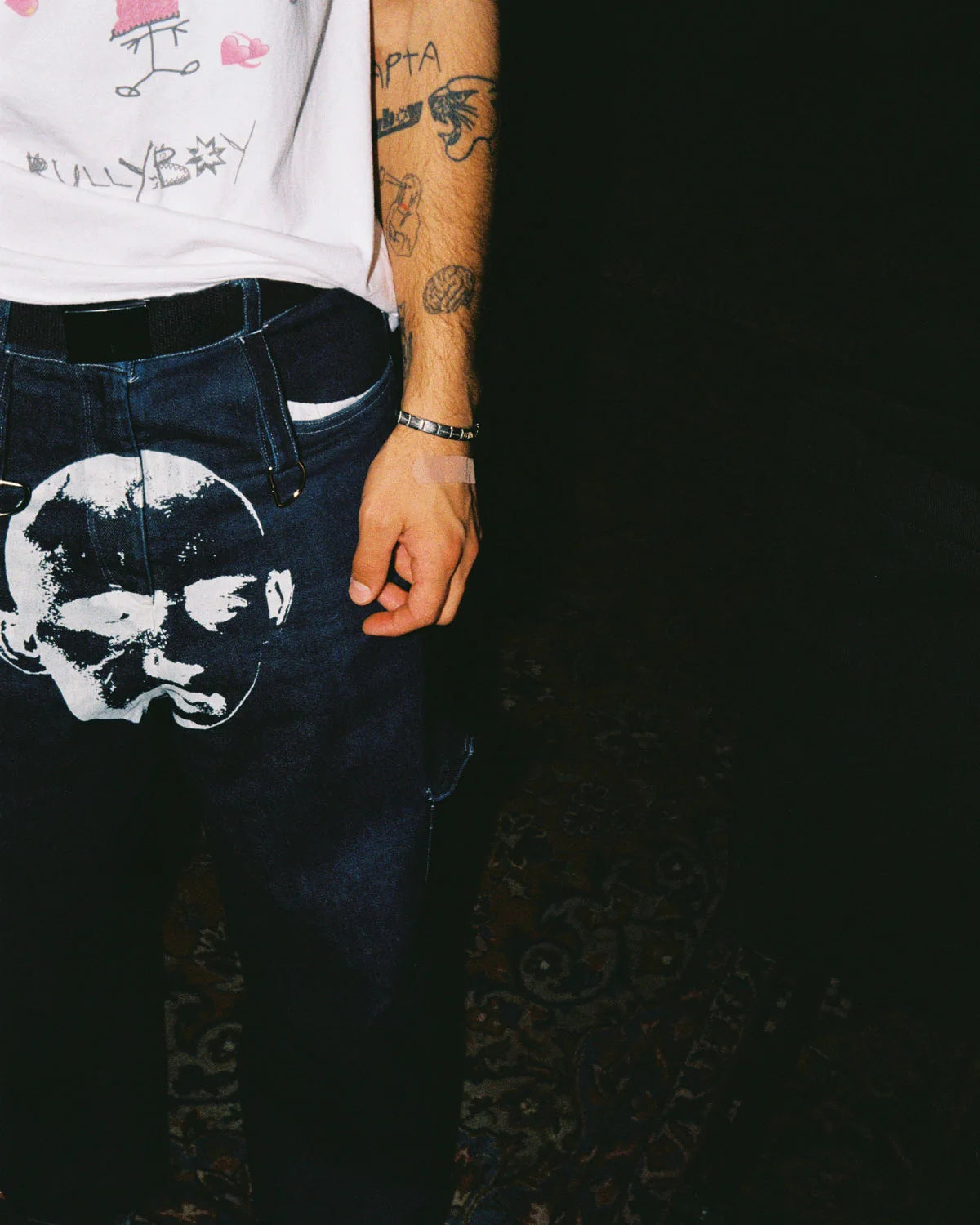 Baggy unisex skater pants made from ethically sourced offcuts featuring a bold white print on the crotch.
