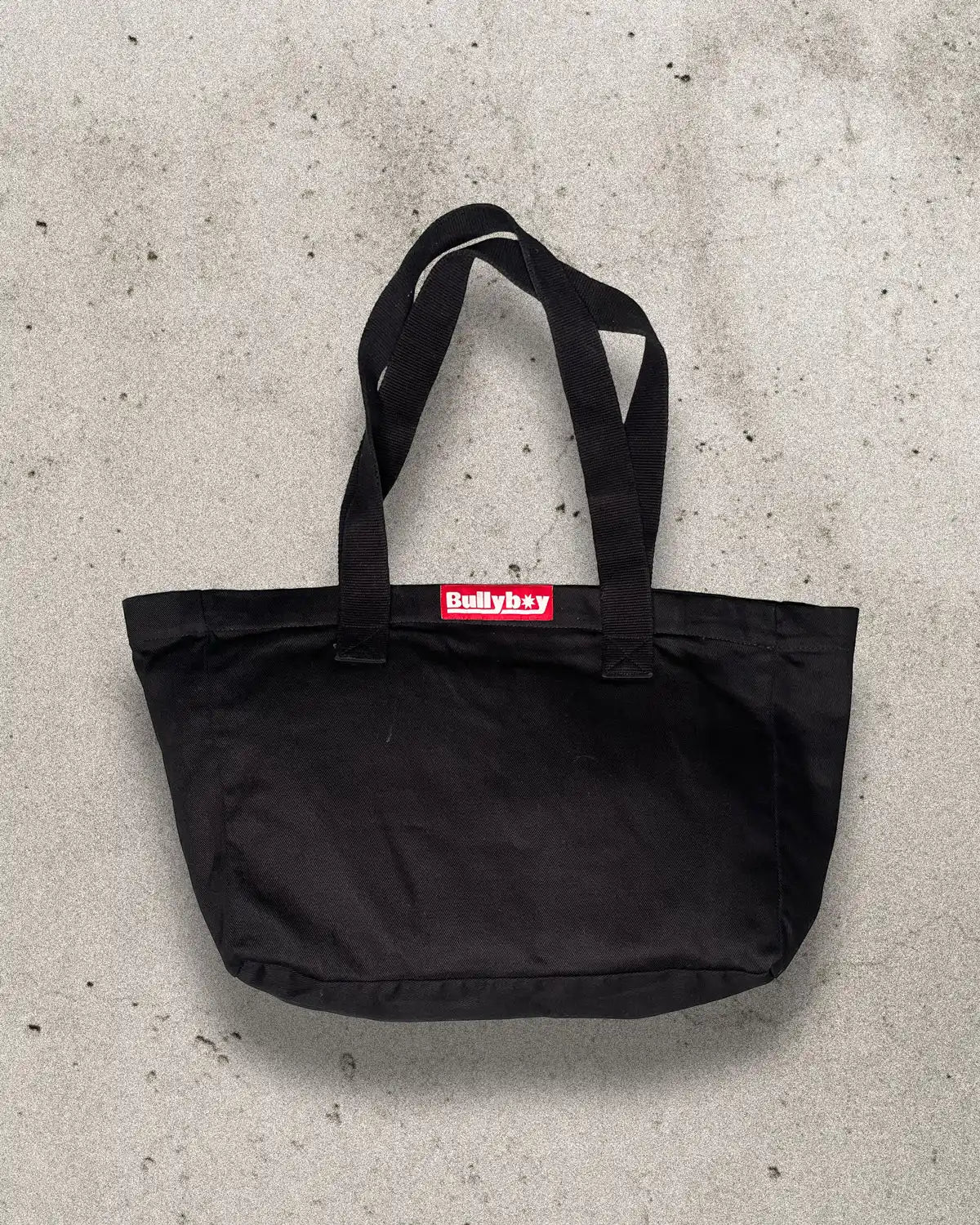 Heavy-duty black bull denim tote bag designed for multi-use.