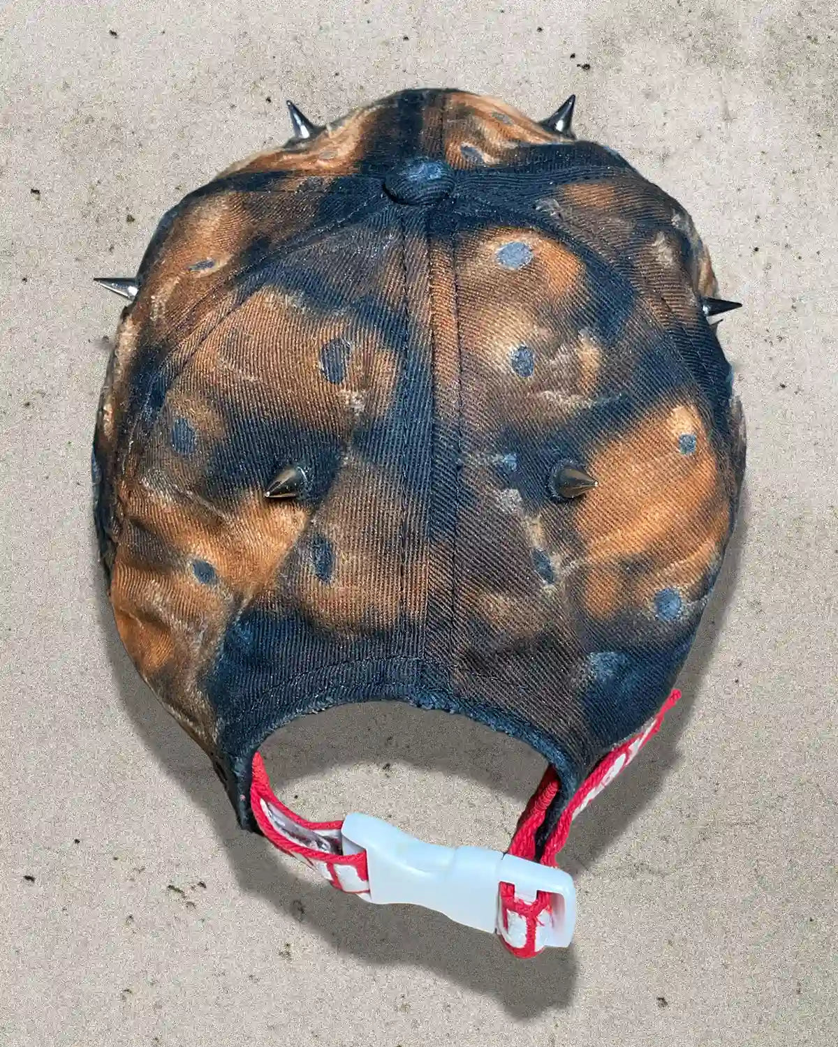 Back view of Bullyboy Rust Bucket cap with red embroidered strap and white clamp closure