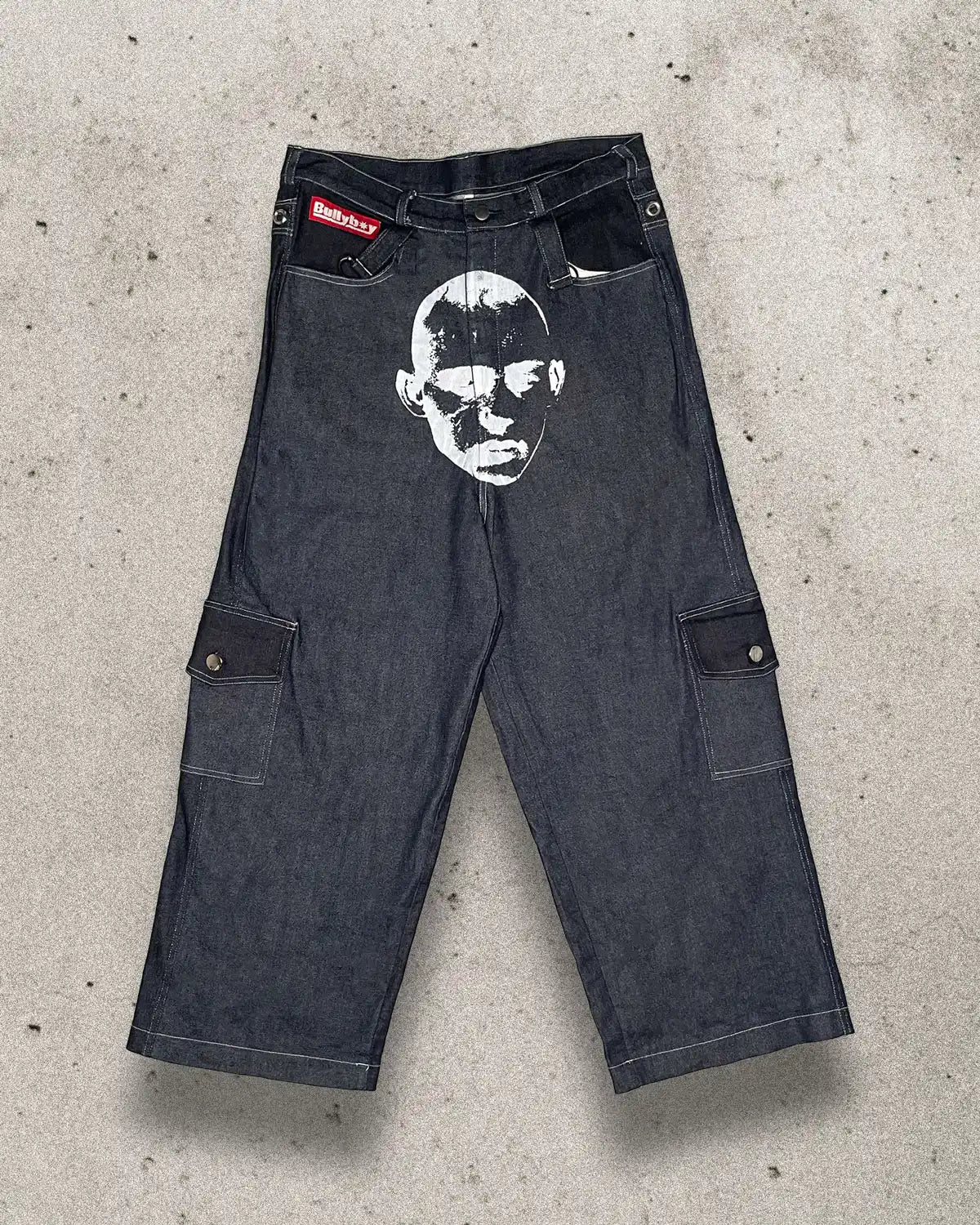 Baggy unisex skater pants made from ethically sourced offcuts featuring a bold white print on the crotch.