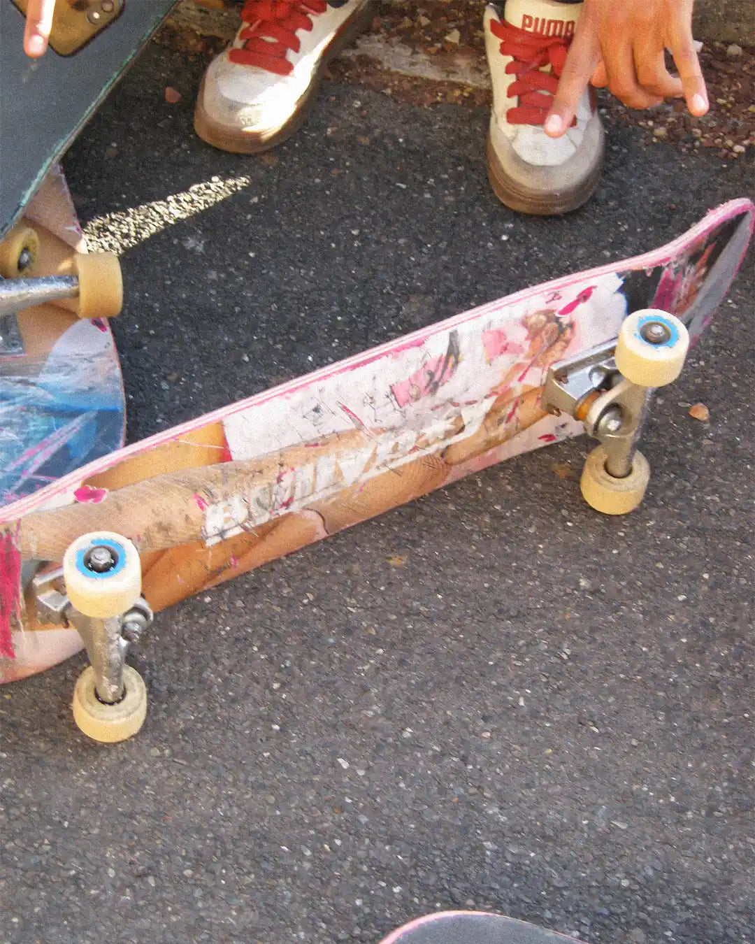 A skateboard featuring a striking image of a woman, part of the Skating Is Risky x Bullyboy skate edit collaboration