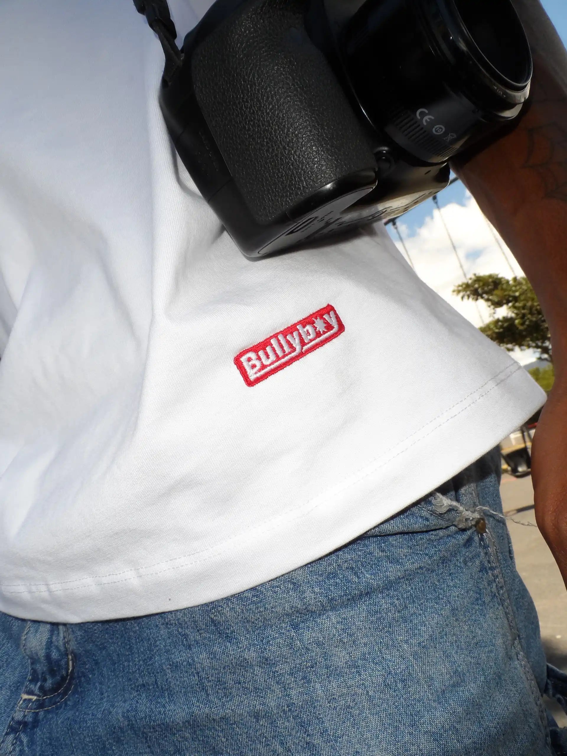 A man in a white t-shirt featuring "bullyboy," showcasing South African streetwear style from Bullyboy Apparel