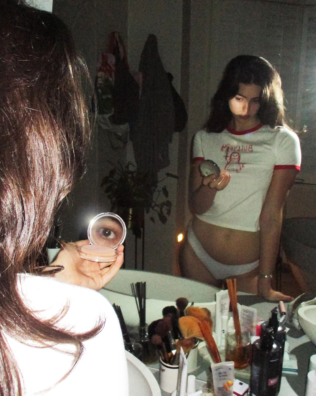 A candid bathroom shoot with female model wearing the new Bullyboy red ringer unisex tee