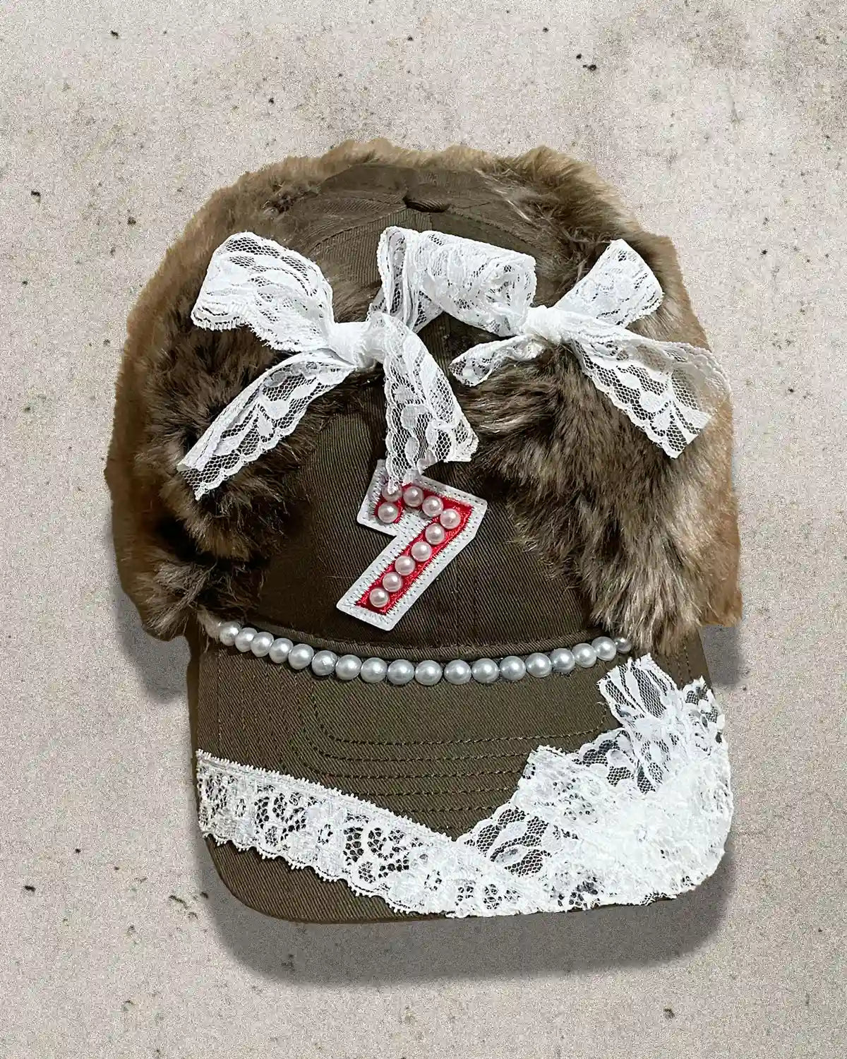 custom streetwear cap with teddy bear ears, pearls, and lace detailing
