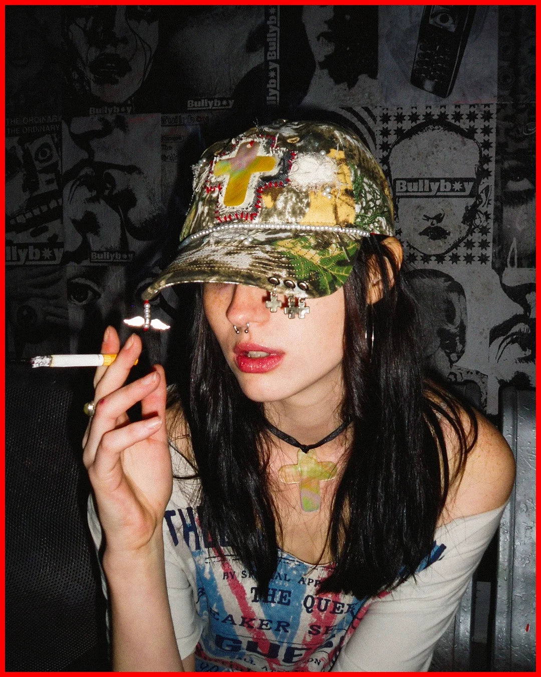 Person wearing a camouflage hat and colorful shirt, smoking a cigarette with a dark, graphic background.