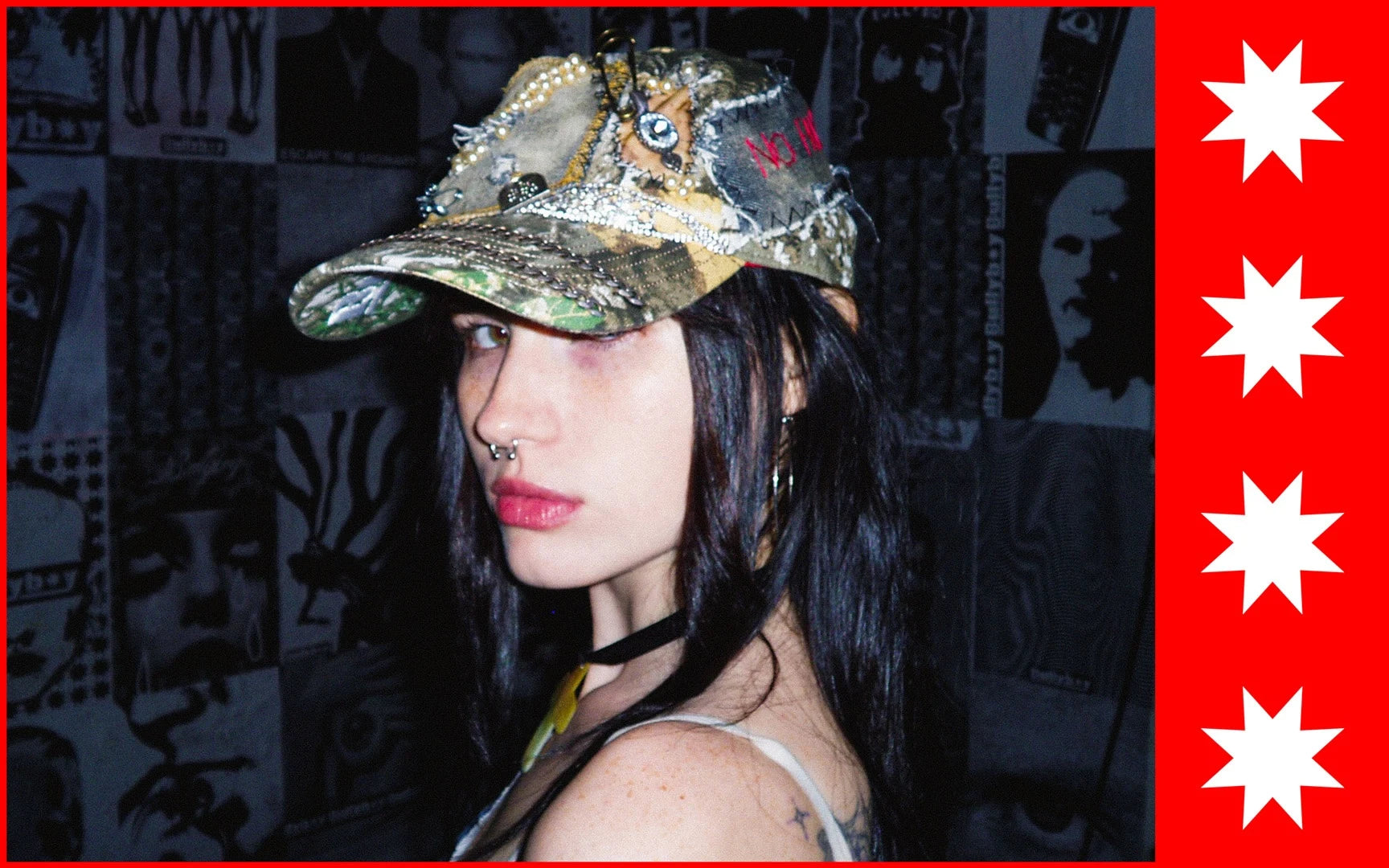 Person wearing a decorative cap with a dark, patterned background