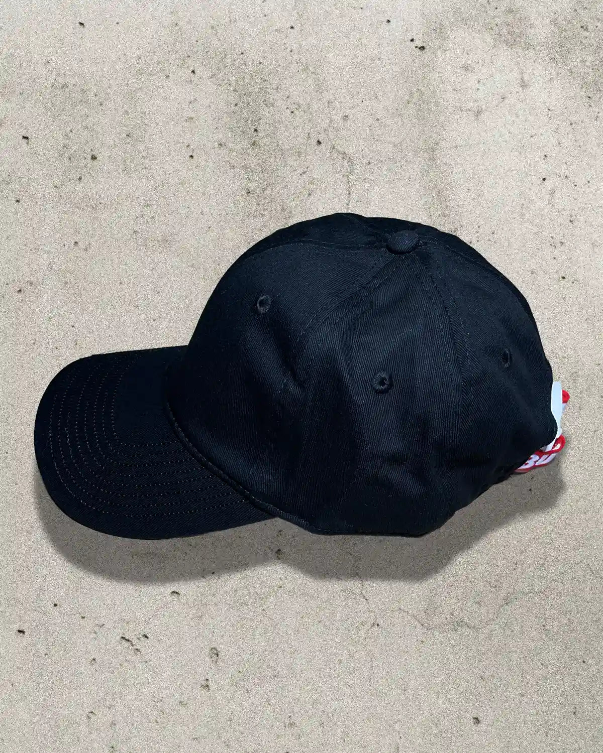 Side profile of black Bullyboy cap highlighting clean silhouette and breathable cotton build
