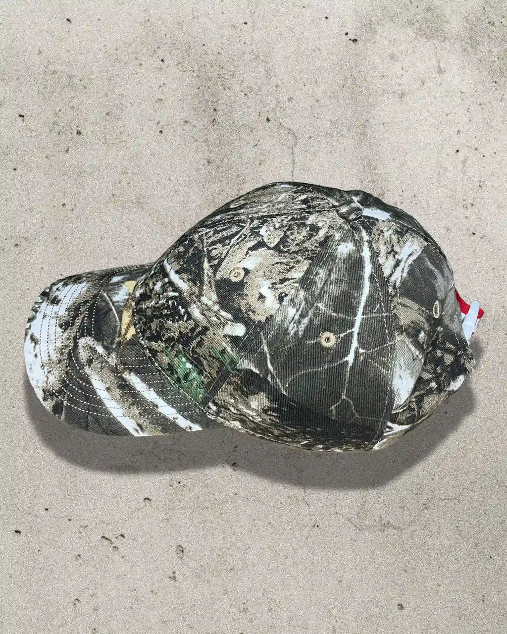 Side profile of camo Bullyboy cap showing structured fit and curved peak