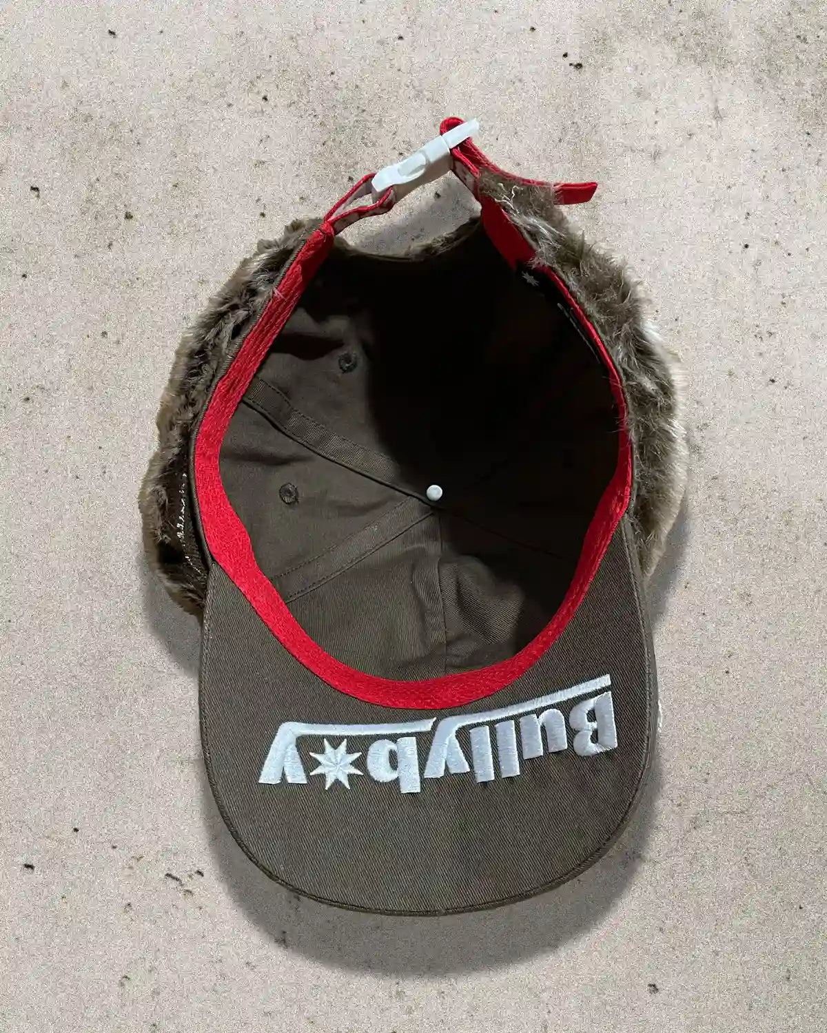 Unique fashion cap mixing childhood nostalgia with rugged street aesthetic.