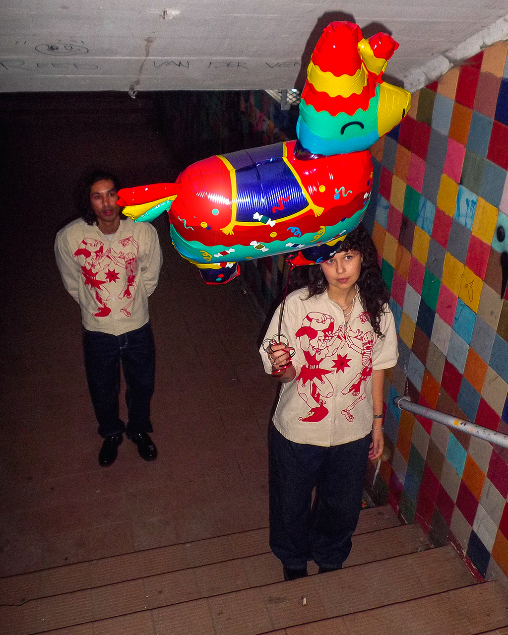 A cool couple under a bridge in Cape Town wearing the newest Bushy Wopp heavy duty button up shirts