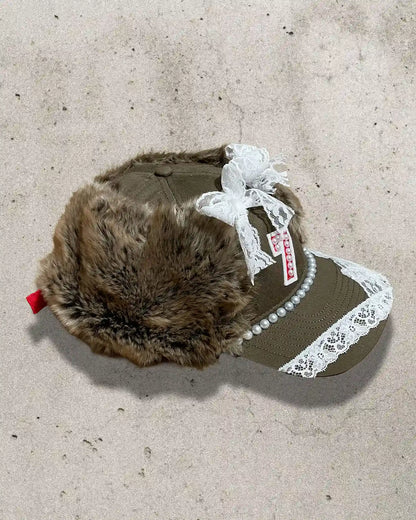 Handmade streetwear cap inspired by fairytales, featuring faux fur and a “7” patch.
