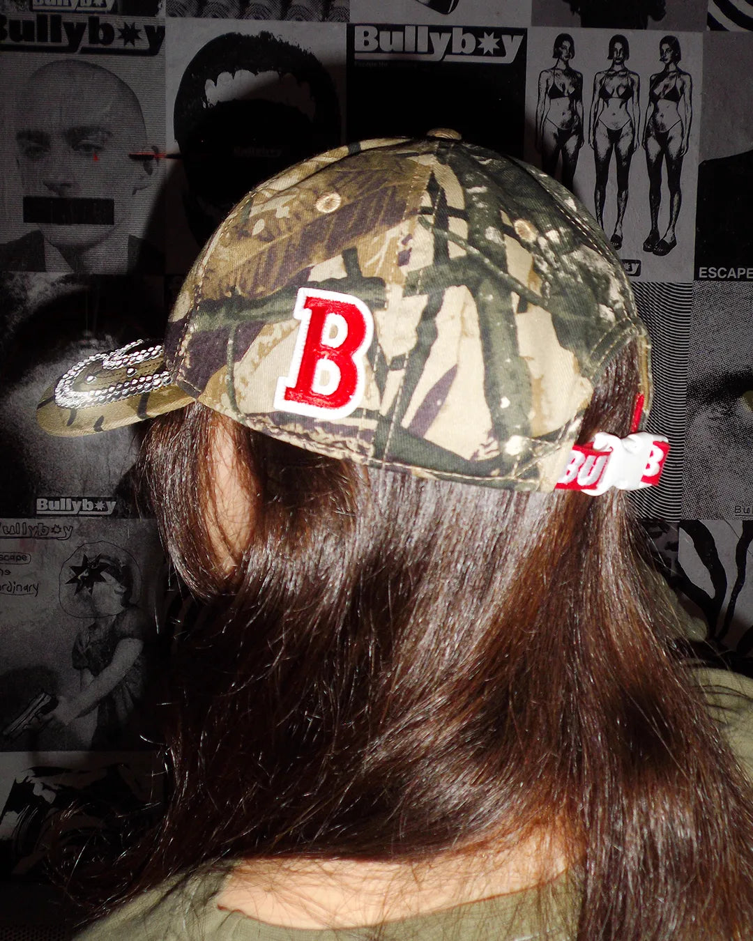 Camo one of one bullyboy cap with a red 'B' stitched onto the cap. The iconic Bullyboy red strap is also visible in this shot