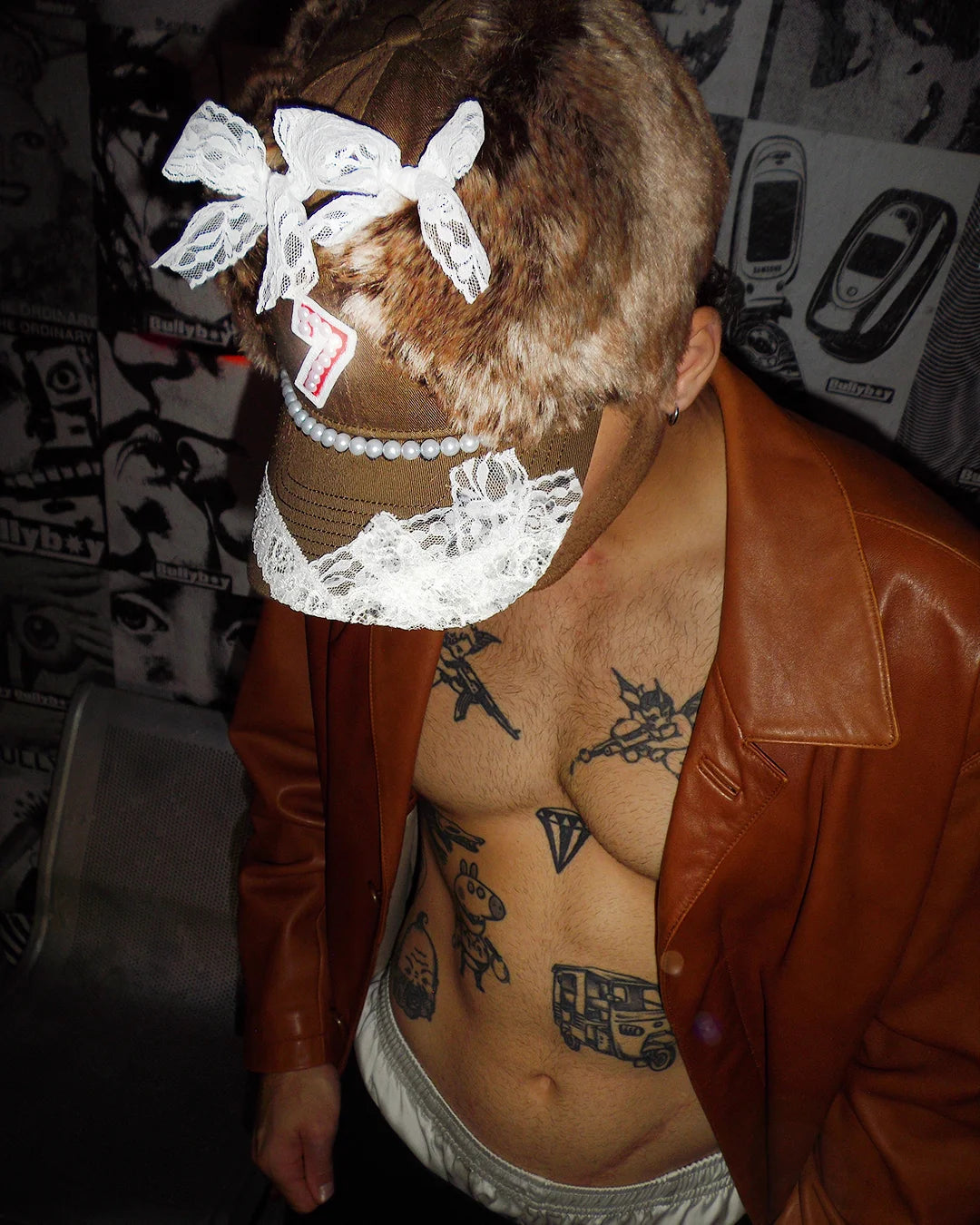one of one dad cap with fur and lace elements worn by a man with a six pack