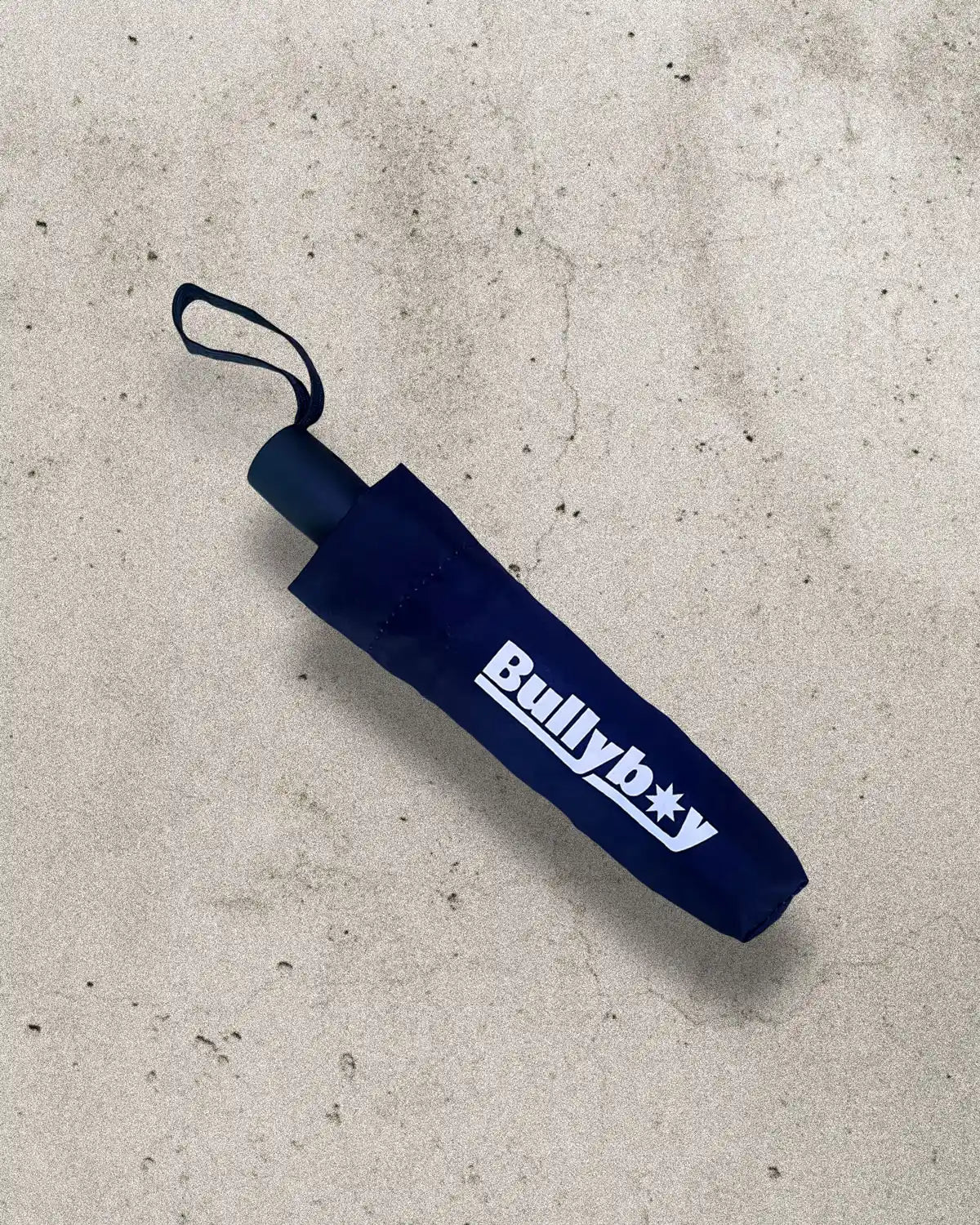 Compact and stylish umbrella with a striking printed design.