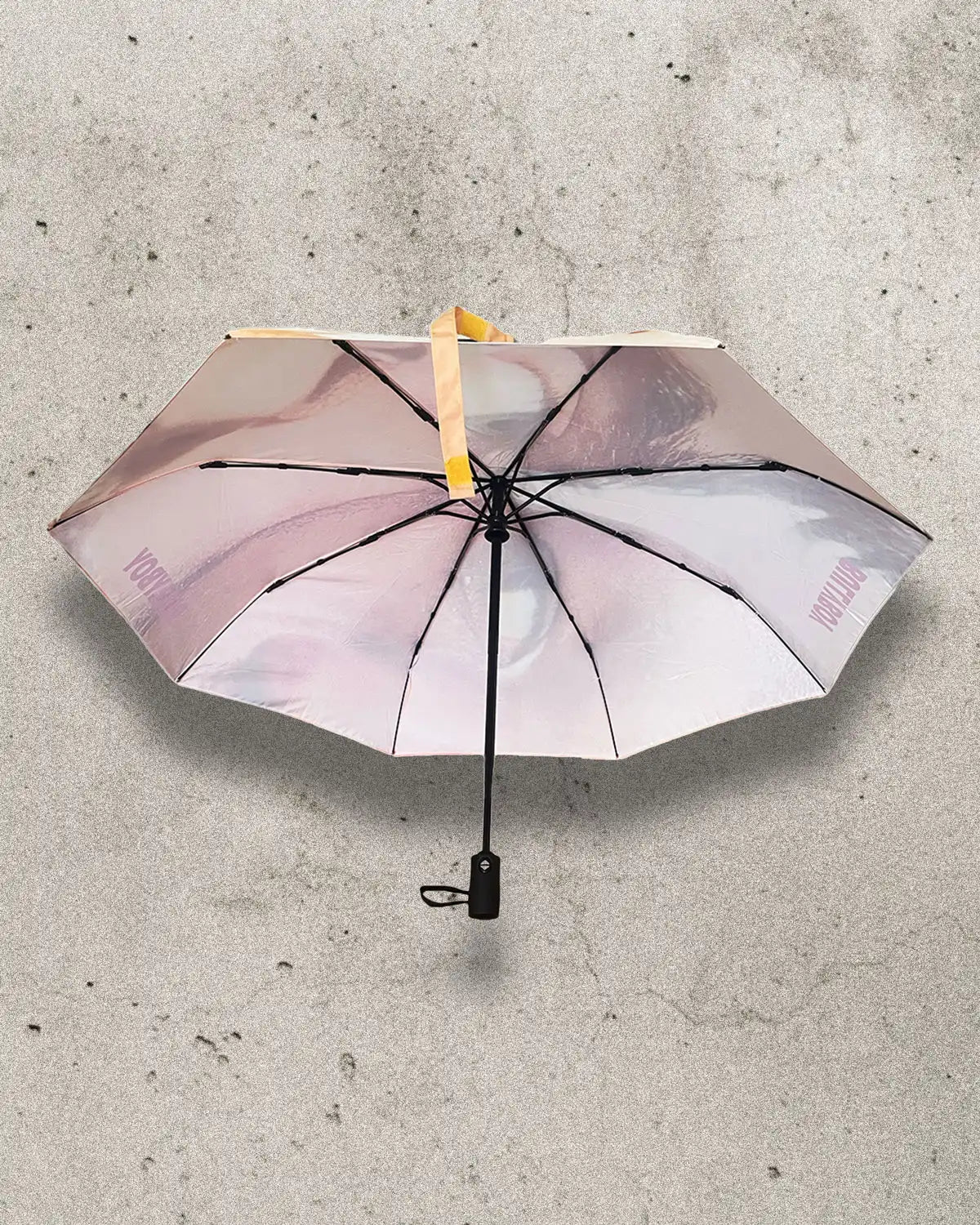 Compact and stylish umbrella with a striking printed design.