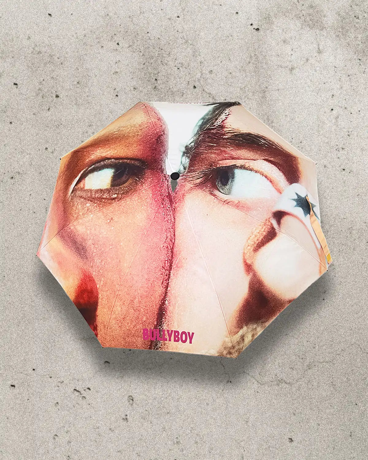 Compact and stylish umbrella with a striking printed design.