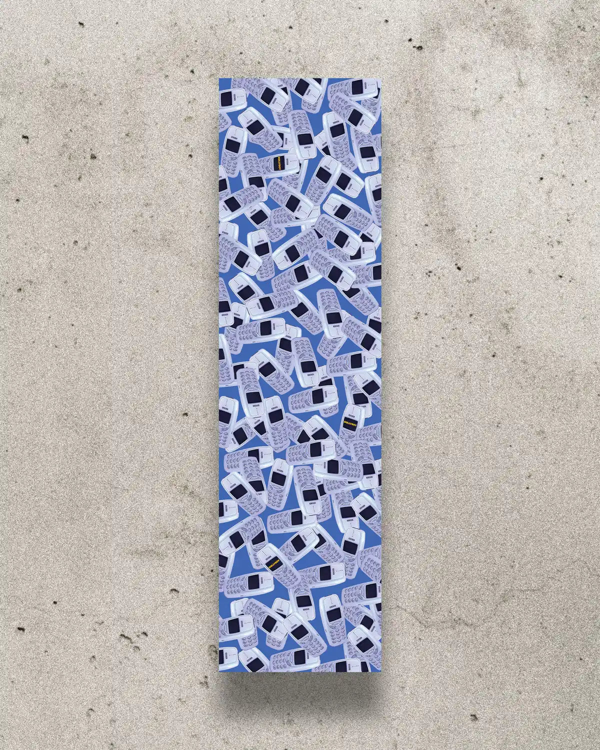 Nostalgic skateboard grip tape with a design featuring Nokia 3310 phones.