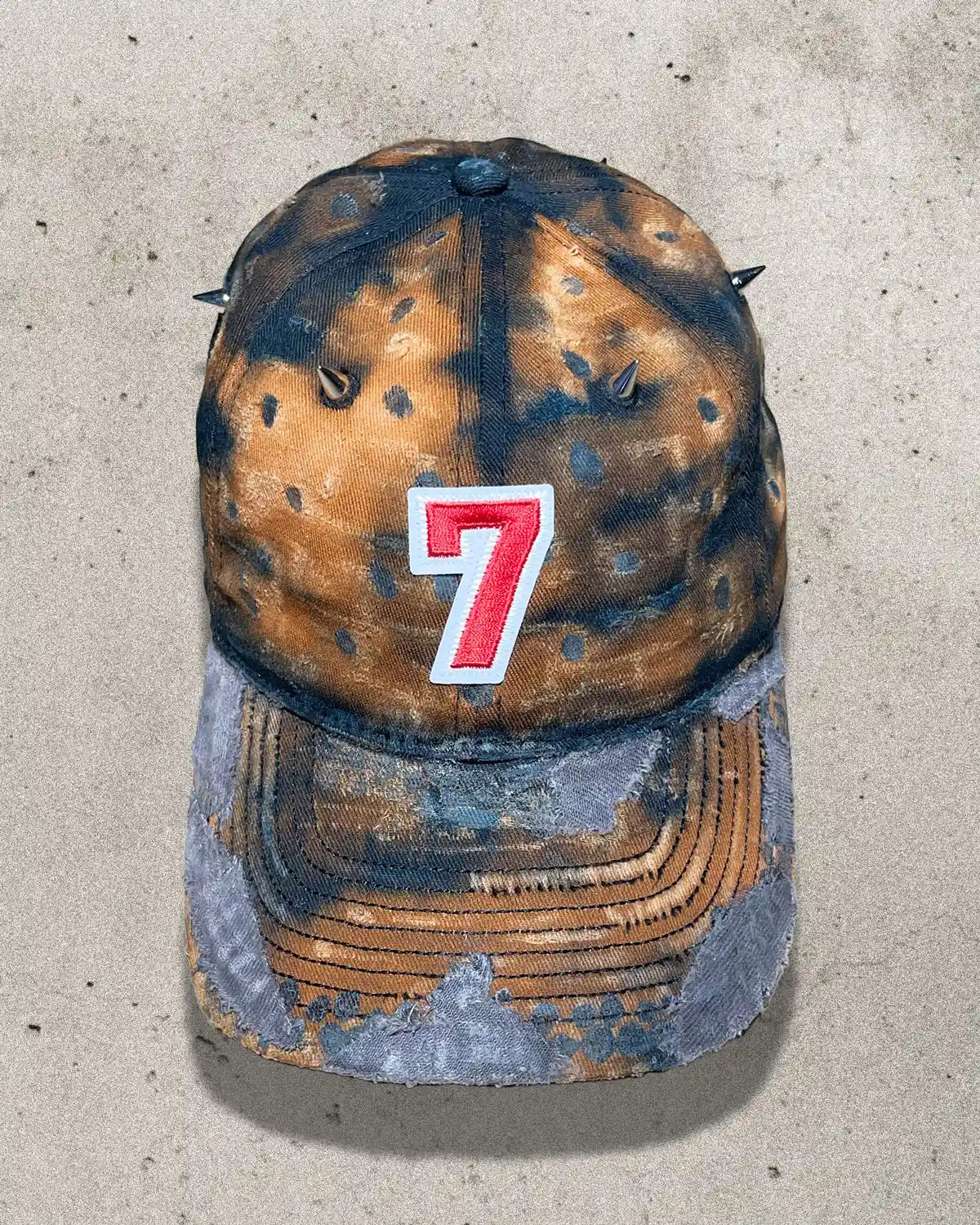 One of one distressed dad cap in rusty orange with metal spikes – front view of Bullyboy Rust Bucket cap