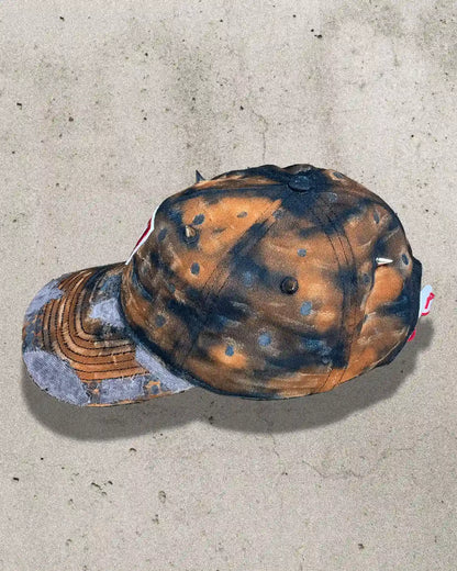 Unique Bullyboy dad cap in rusty orange with metal spikes – side view showcasing streetwear design