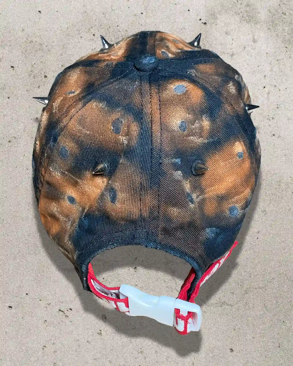 Back view of Bullyboy Rust Bucket cap with red embroidered strap and white clamp closure