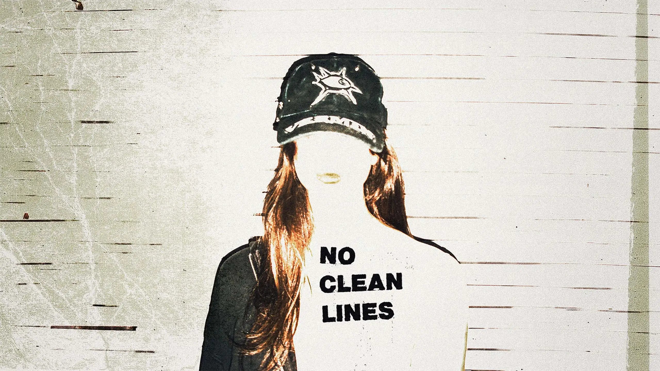 Person wearing a cap with 'No Clean Lines' text on a textured wall background