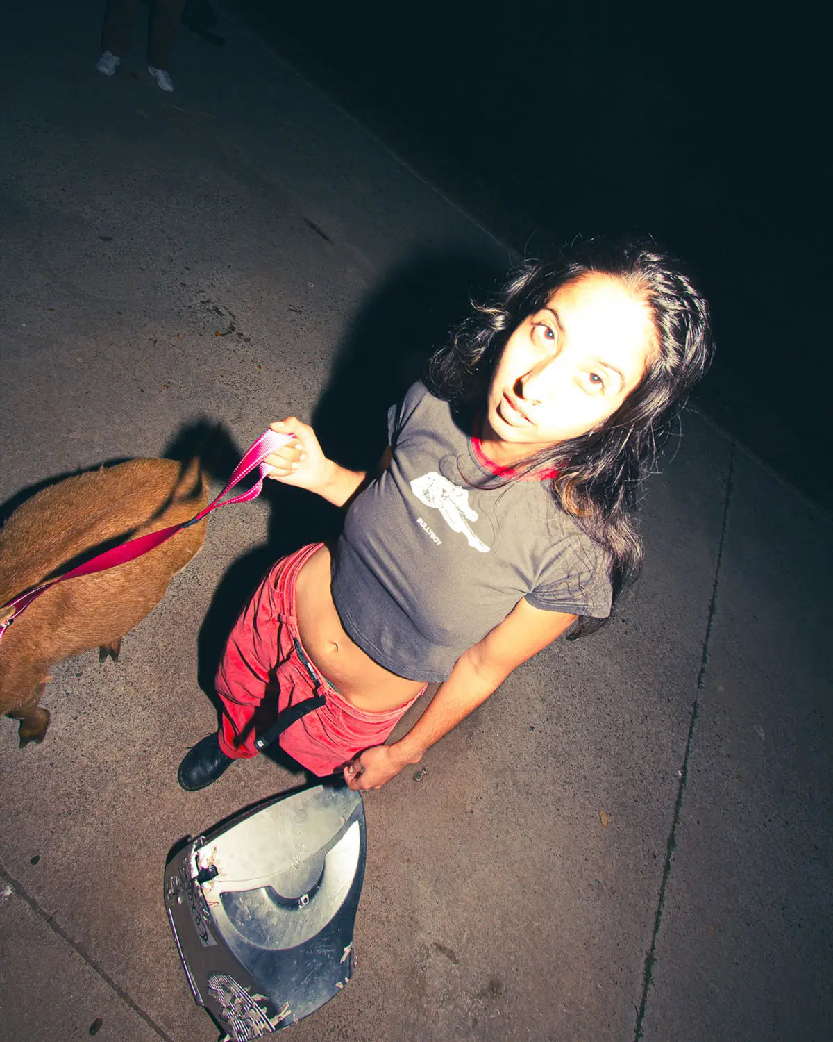  A stylish woman walks her goat on a leash, showcasing Bullyboy's premium streetwear in vibrant Cape Town.