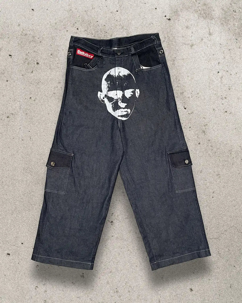 Baggy unisex skater pants made from ethically sourced offcuts featuring a bold white print on the crotch.