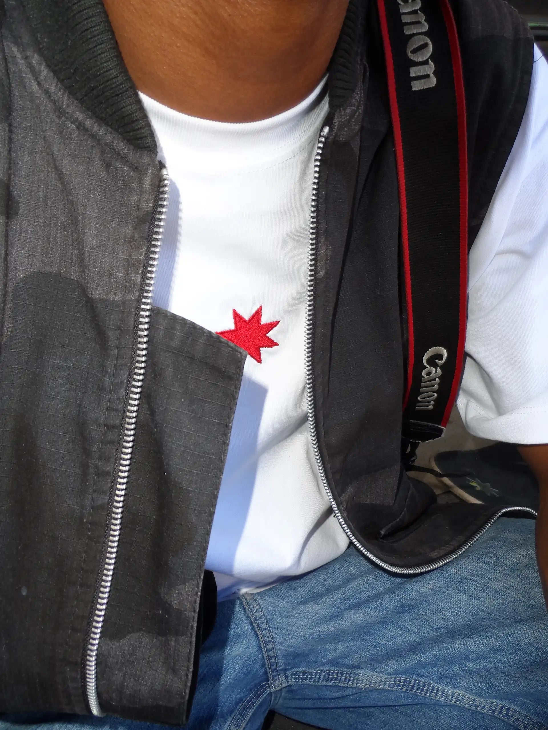 A man in a stylish black jacket, showcasing Bullyboy streetwear from South African fashion